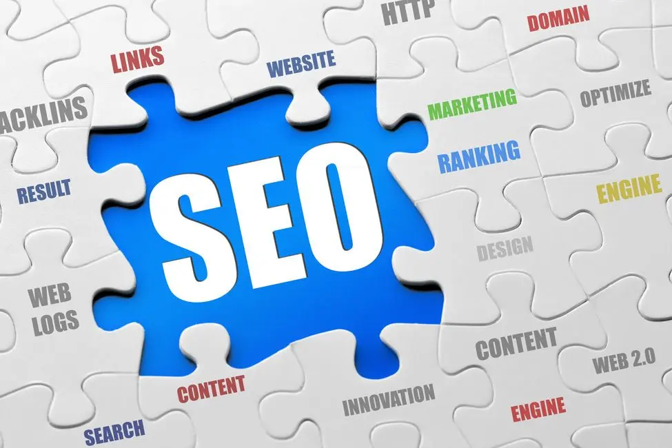 SEO concept image featuring a puzzle design with SEO at the center, surrounded by keywords such as content, ranking, backlinks, website optimization, and search engine marketing, illustrating the role of SEO in business growth and its comparison with social media marketing strategies.